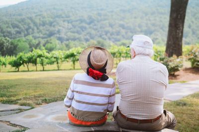 An older couple sitting together outdoors